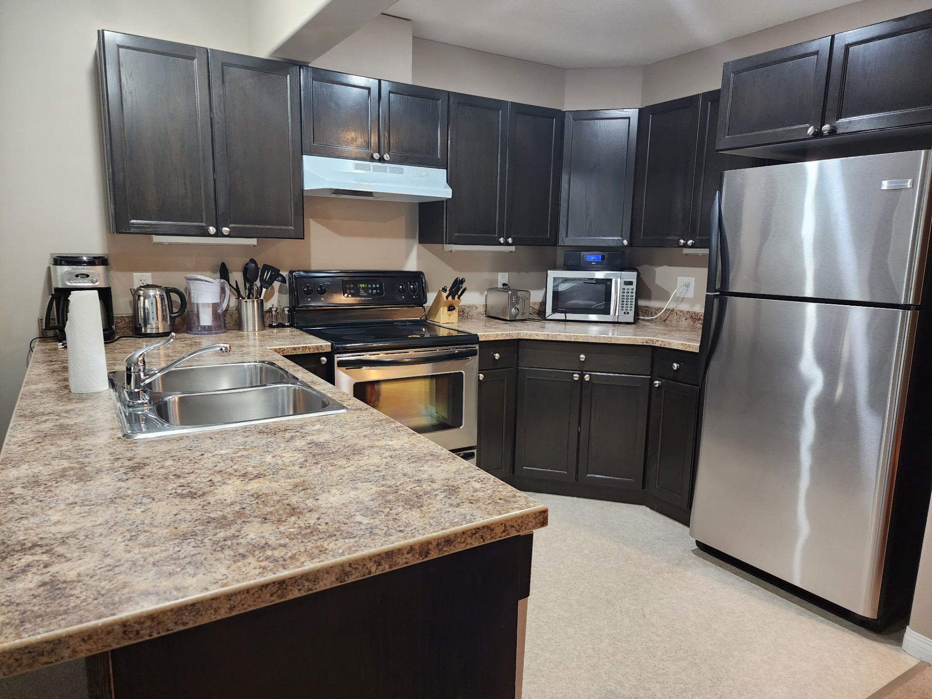 Sparkling kitchen with polished stainless appliances