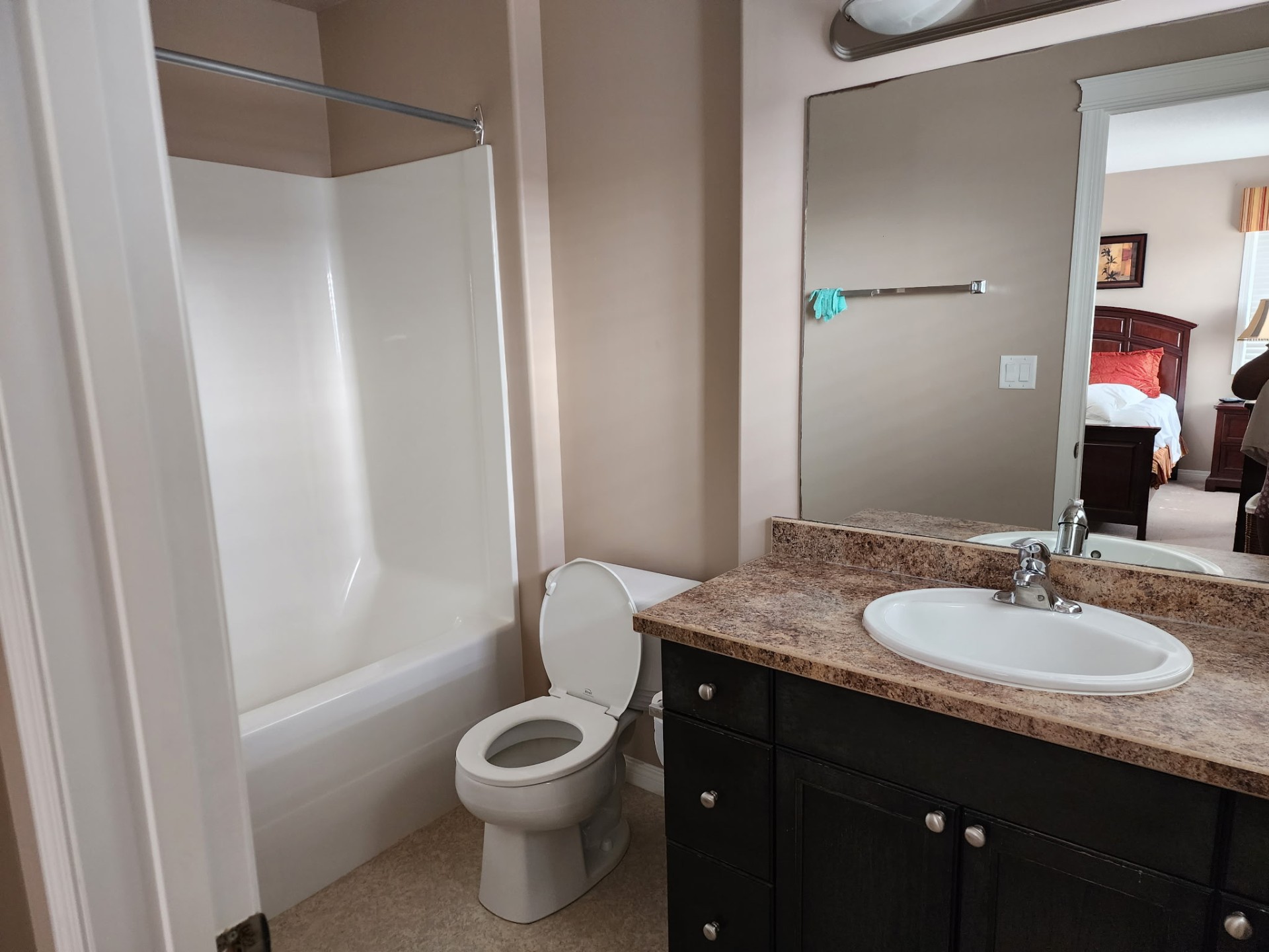 Freshly cleaned bathroom with tub and vanity