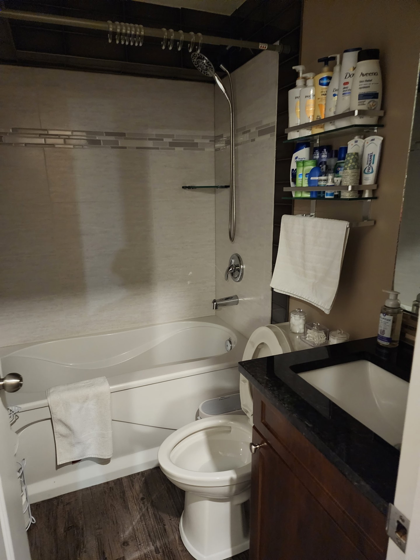 Detailed bathroom with polished tub and vanity